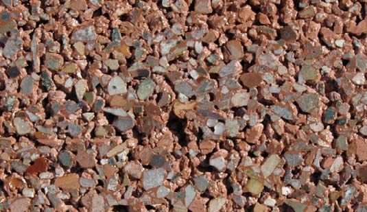 This pervious concrete is integrally colored, lightly dry-diamond ground and finished with a light coat of sealer. No special aggregates were used.