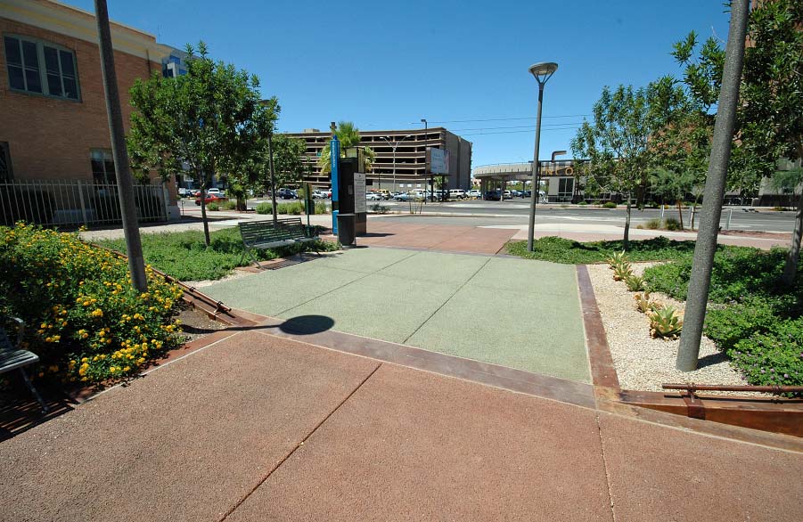 This plaza area in Phoenix features pervious concrete thats been colored terra cotta and green with spray-applied lithium-based stain from Bomanite. Photo courtesy of Progressive Concrete Works