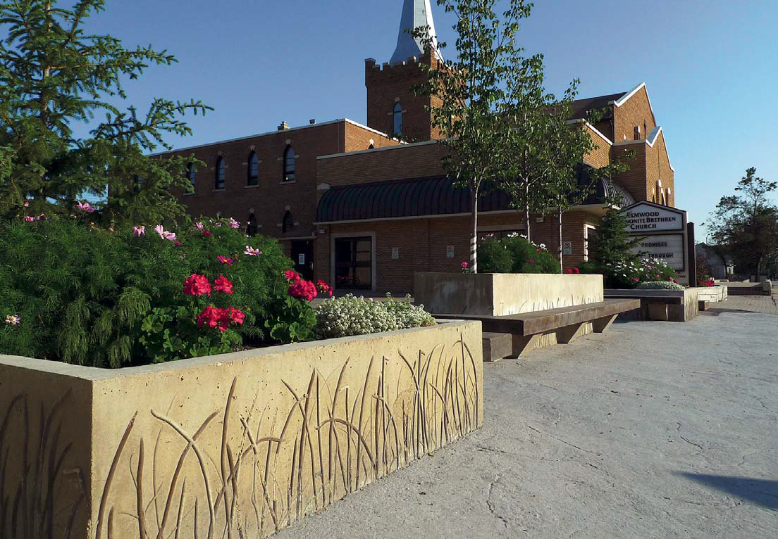Smooth, weathered looking concrete planter walls with reed like impressions
