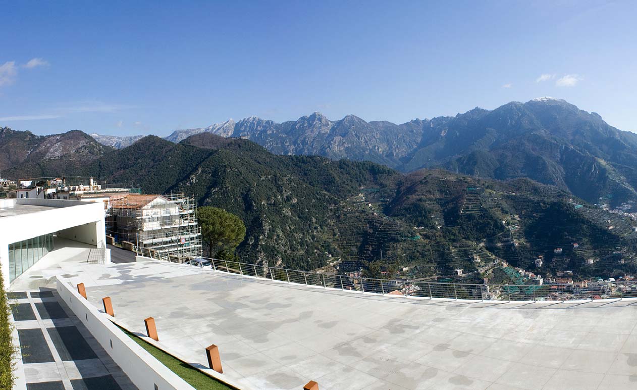 At the new Auditorium Oscar Niemeyer in Ravello, Italy, 25,000 square feet of decorative concrete guides attendees to the main entrance (at right of photo).