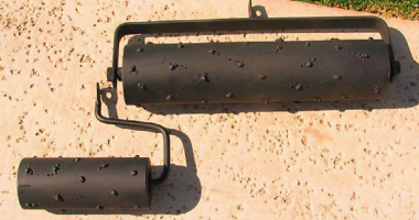 Hand rollers for concrete to make the appearance of a rock salt finish.