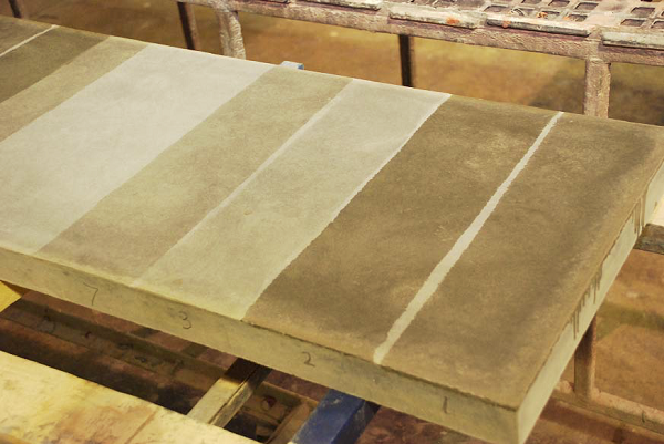This test slab demonstrates how different sealers leave different-looking finishes on the same concrete.