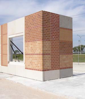 Tilt-Up Walls - A mock-up panel of window and brick work for an American Constructors Inc. project. It shows two different mix designs and sandblasting.