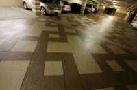 Dark and light areas of this concrete overlay give a geometric look to the space.