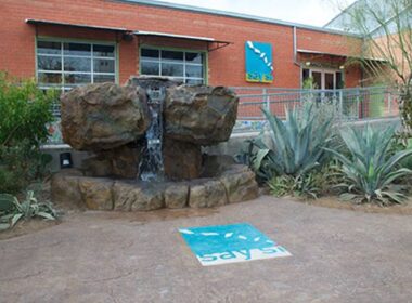The front entrance of Say Si with a carved water feature and stamped patio with fiber optics.