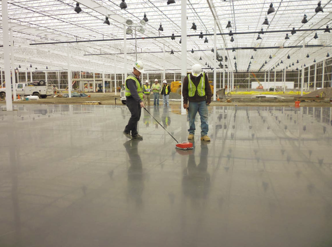 Workers for testing company ATC Associates Inc. take flatness readings at a future Costco store in New Jersey. Photo by Jennifer A. Faller
