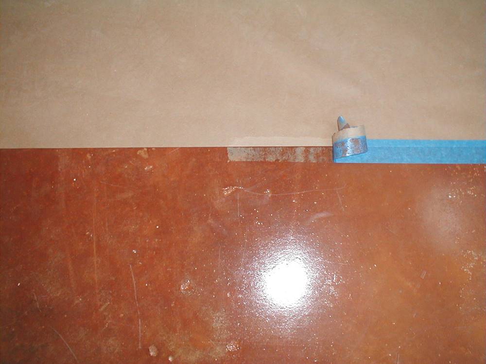 problems with tape on concrete can arise like here with the blue painter's tape on stained concrete
