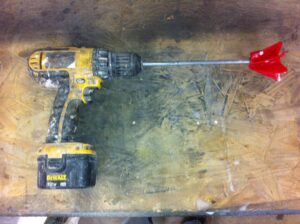 A drill with a mixing blade used for mixing concrete countertop sealers