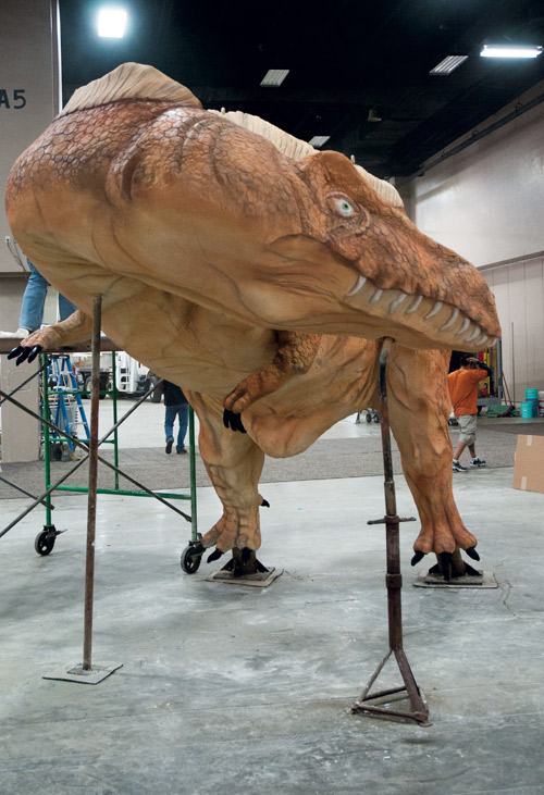 Dinosaur sculpted of concrete at a Concrete Decor Show.