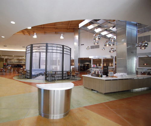 Evans crew acid-stained about 2,500 square feet of the athletic facilities and 8,000 square feet of the 19,400-square-foot dining hall, using a greenish-gold color around the salad bar and three of Scofields warmest colors for the rest of the floor.