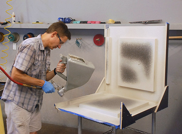 spraying a mist coat for the concrete furniture mold