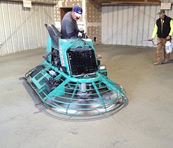 Ride on power trowel on a micro-overlay.
