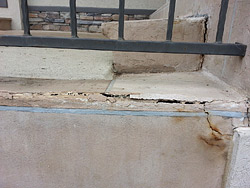 Water intrusion causing failure around the steps.