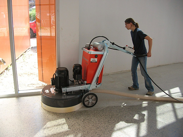 Using a grinder on a concrete floor