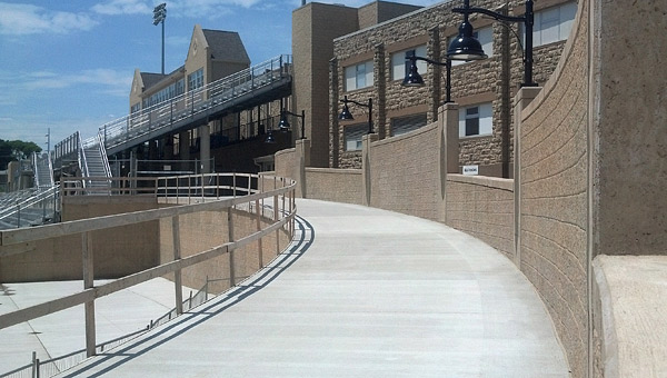 concrete walkway next to busy road