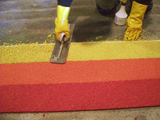 TPV can be applied with a trowel in more than one bright color, as seen here in a four-season room overlooking Rainbow Lake in Michigan.