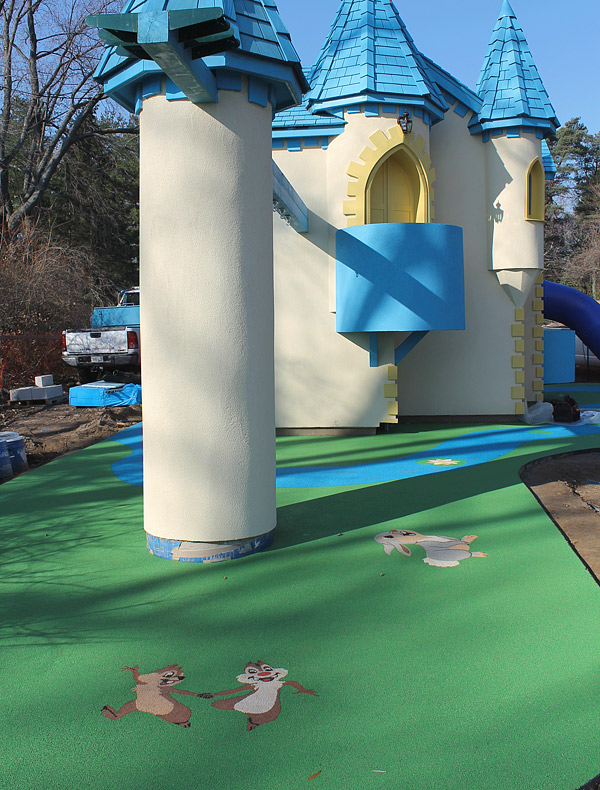 TPV rubber kids play area - One of the more whimsical projects John Schroeter, of Toronto, Ontario, has done involves a childrens castle, complete with precast cartoon characters made from colorful TPV. The TPV floor inside looks like cobblestone. Photo courtesy of Ideal Surfacing