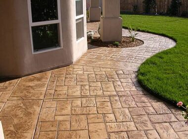 a stamped concrete patio with sealer on it