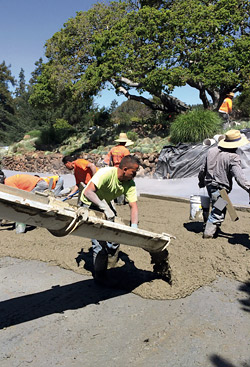 Pouring concrete for walkway.