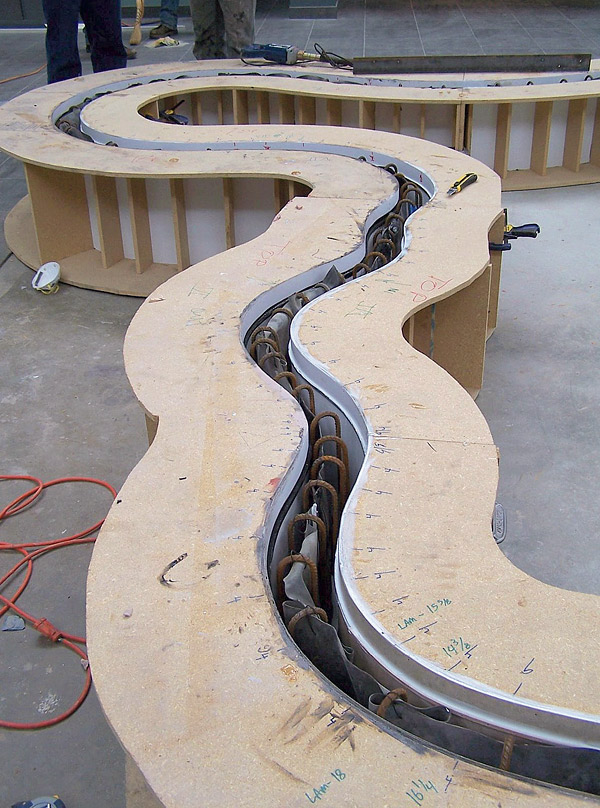 Particleboard concrete casting system.