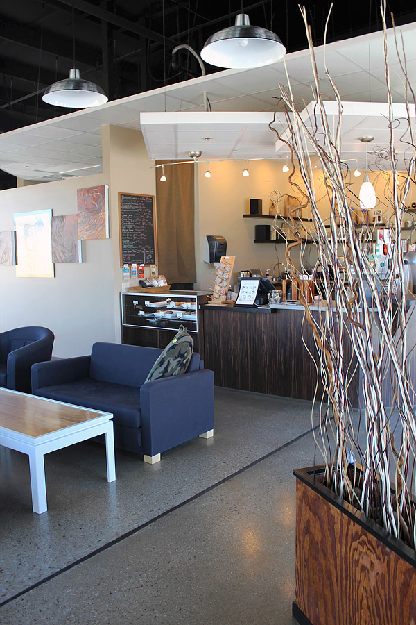 Residual mastic was ground off the existing concrete floor in this Fort Wayne, Indiana, cafe, exposing the natural aggregate. A clear epoxy primer was applied, followed by a matte-finish urethane. Photo courtesy of Delineation Inc.