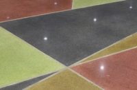 Polished concrete with different color dyes in a museum.