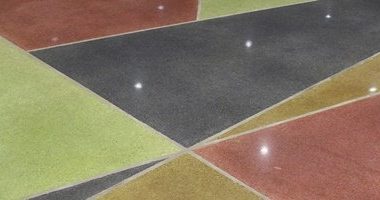 Polished concrete with different color dyes in a museum.