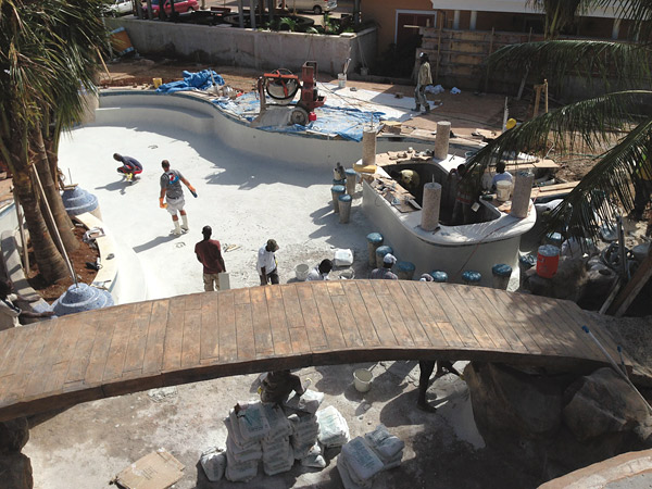 The bridge was formed with a plywood form, 2-by-4s and wood poles for support. A double layer of 5/8-inch rebar and 8 inches of concrete were specified.