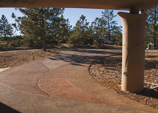 colored pervious concrete driveway The pervious driveway is colored with five different colors to match parts of the house. Photos courtesy of Concrete Management Solutions