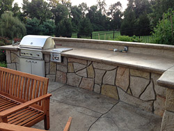 carved concrete outdoor kitchen