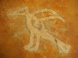 Acid etching of stain through cut felt fabric.