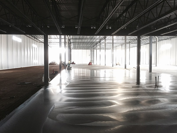 Multiquip SlabArmor being ground down with a grinding machine. Beauty may only be skin deep, but the performance qualities of an MQ Whiteman SlabArmor concrete surface are just as impressive as the strikingly good looks the SlabArmor system delivers.