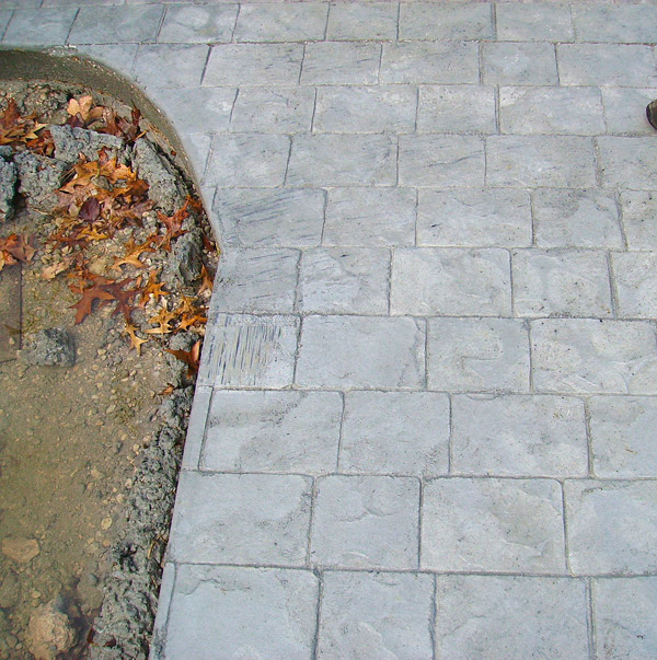avoiding streaks on concrete with colored release powder - Any dragging or sideways movement of tools can lead to the colored release powder streaking. Photo courtesy of Chris Sullivan