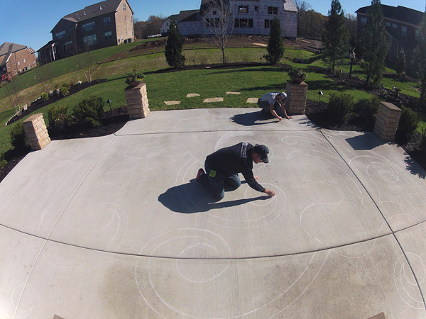 initial drawing of design on a concrete slab