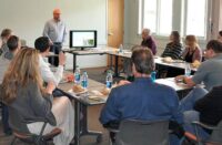 Group of architects listening to a presentation about decorative concrete