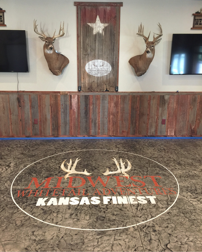 Midwest Whitetails Adventure logo embedded logo on brown floor
