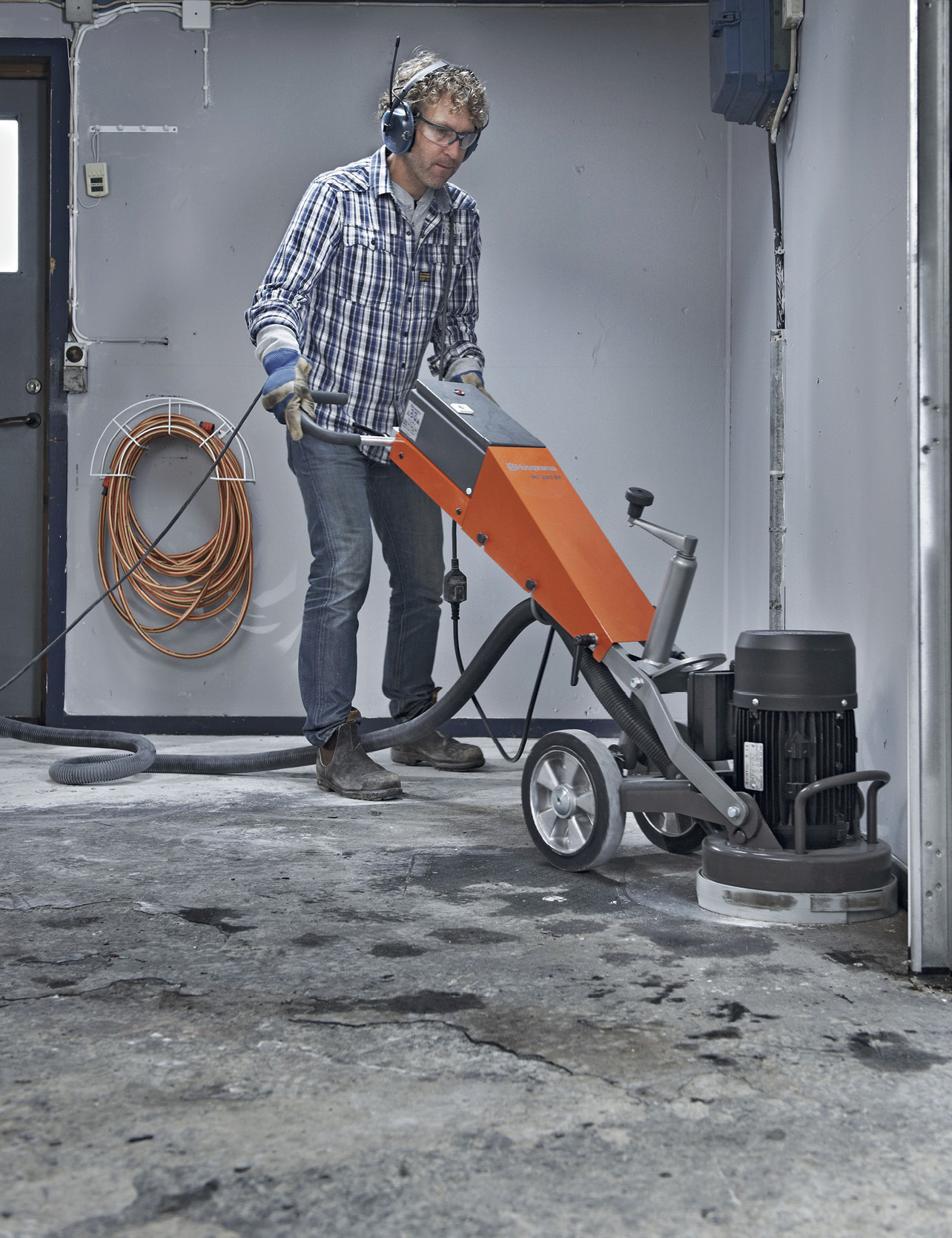 man polishing a concrete floor