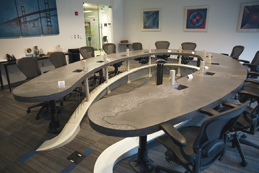 This 17-by-11-foot table serves as the centerpiece of a new corporate headquarters, with ample seating room for a dozen or more. 