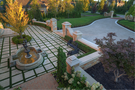About 3,000 square feet of concrete was placed for the driveway, with the bands poured separately and finished with a limestone texture.