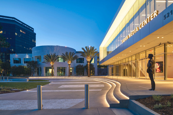 The theater and media center feature radius stairs, planter walls, curbs and nearly 15,000 square feet of sand-finished paving with alternating bands of hand-seeded white aggregate. 
