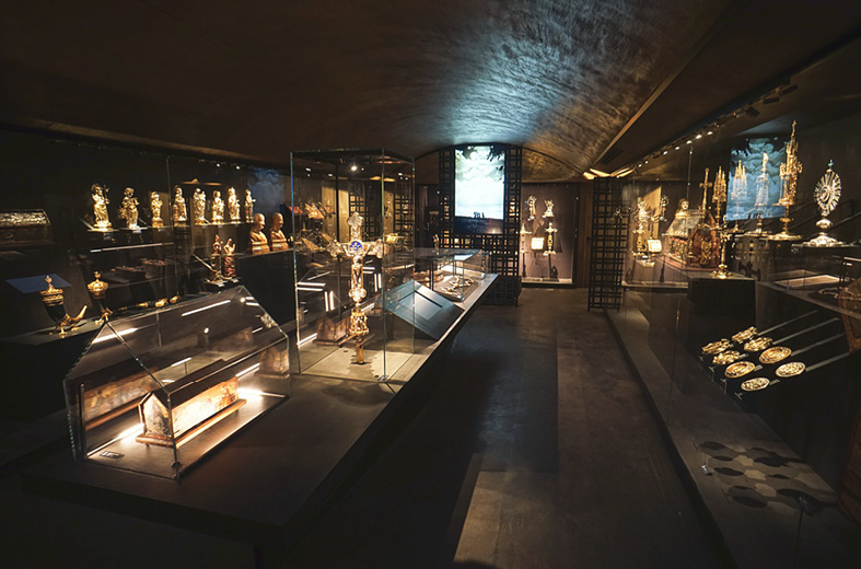 Stained Concrete floors and dark brown concrete countertops in a gold statuary store in Italy.