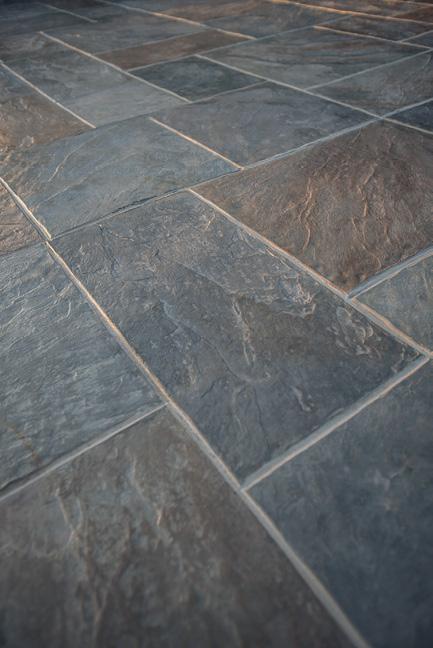 This stamped concrete could fool a tile setter to think this was actual slate rectangular tiles.