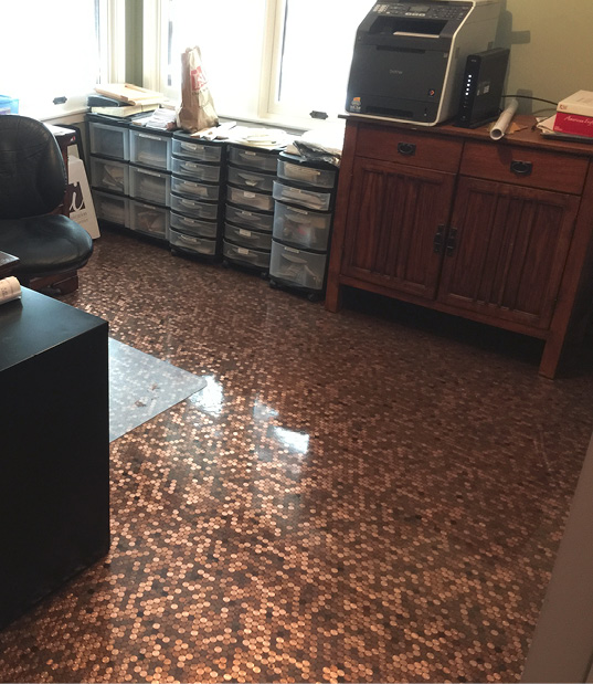 Before putting the pennies in rows, a base coat of E100-PT4 tan pigmented epoxy from Elite Crete was applied, he says, adding that you can also use a black-tinted epoxy and get good results.