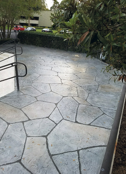 Concrete overlay flagstone project that involved a scratch coat of Stone Edge Pro Bond top-coated with Stone Edge Pro Stamp Mix, an overlay which was stamped, carved and colored.Photo courtesy of Stone Edge Surfaces