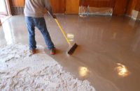 Self-Leveling Concrete Compound being spread on concrete