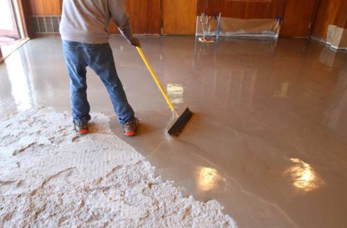 Self-Leveling Concrete Compound being spread on concrete