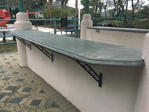 Unique teal green bar tops made of concrete for a clubhouse in Destin, Florida.Photos courtesy of Concrete In-Counters concrete countertop