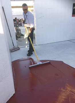 Laticrete applying a premium epoxy coating system at Concrete Decor's Decorative Concrete Live at World of Concrete 2018.