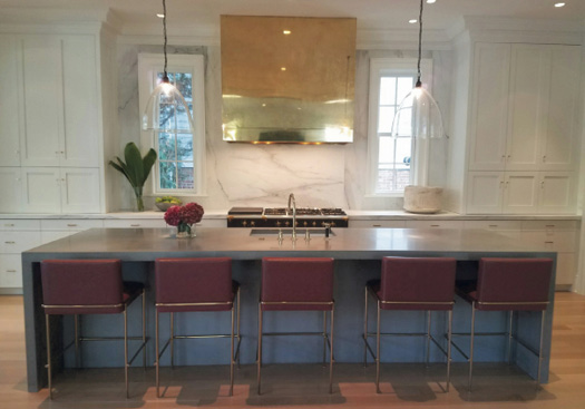 One side of this one-piece 850-pound countertop, which measures 12-feet-by-50-inches, is cantilevered over the cabinets by 12 inches to allow for seating.