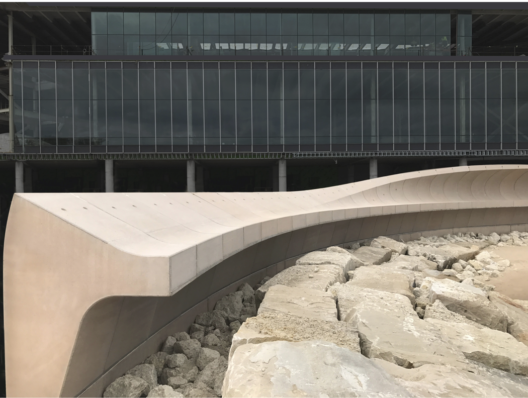 The precast panels were mounted on a cast-in-place kneel wall using both column-base connectors on the land side and splice sleeves on the lake side